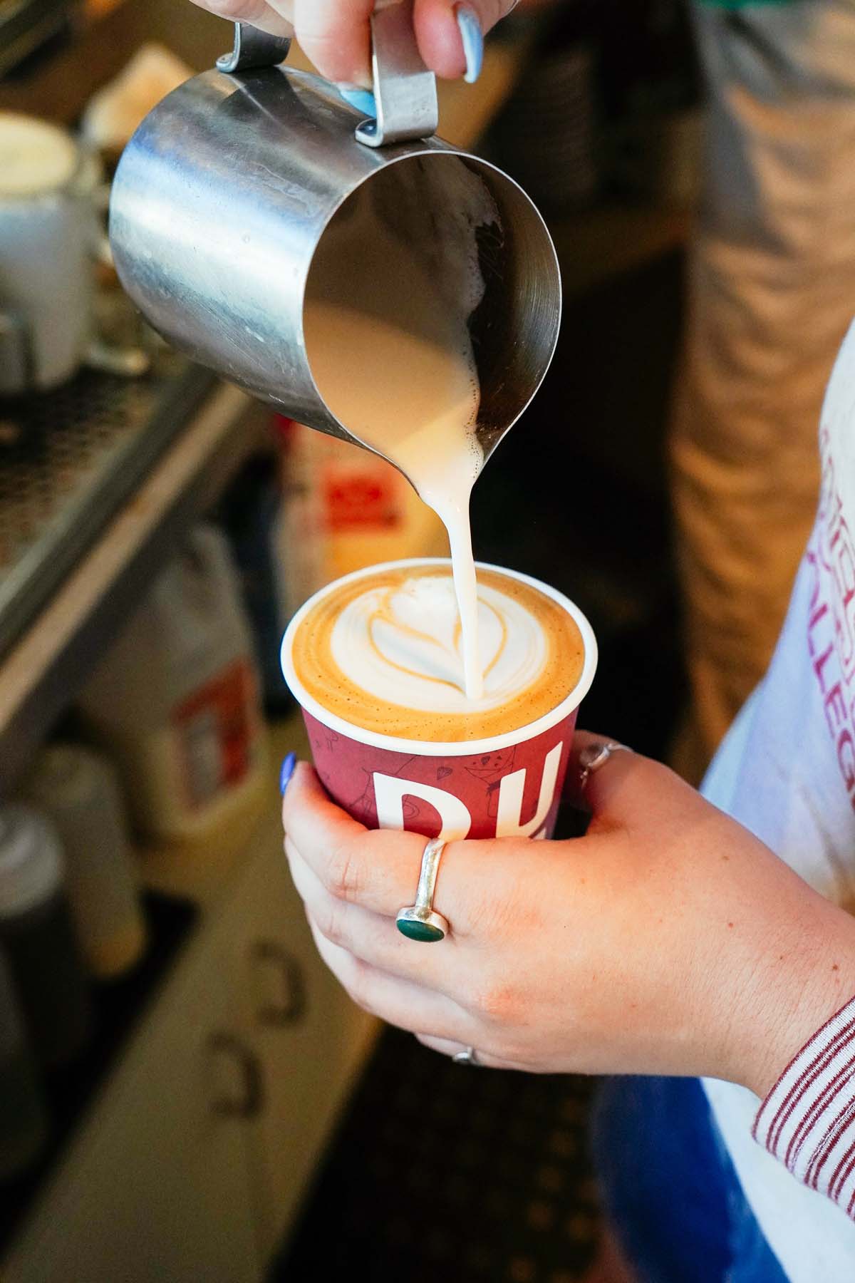 Rosetta Latte art being poured in to a cup