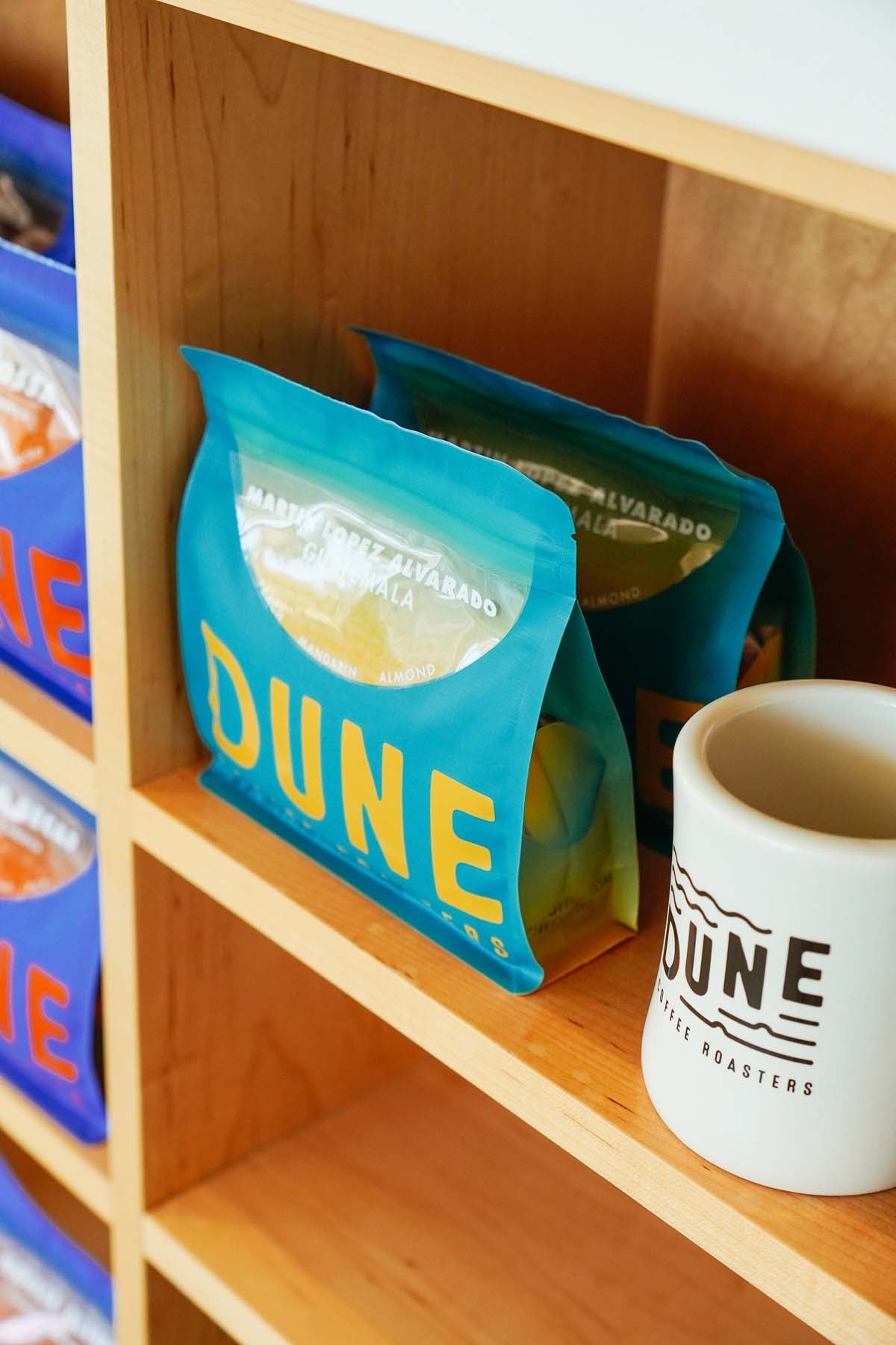 product display photo of traditional single origin coffee and white dune coffee mug